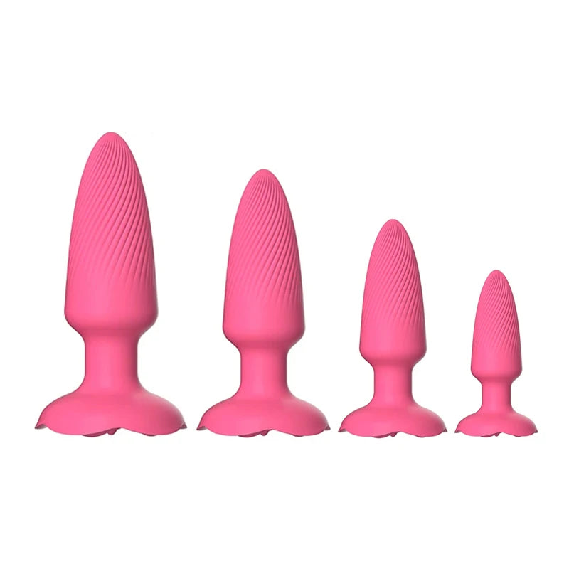 Four pink ribbed silicone anal plugs in graduated sizes, shown upright on white
