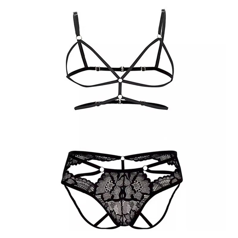 Black strappy harness bra and matching floral lace cutout panties on a white background