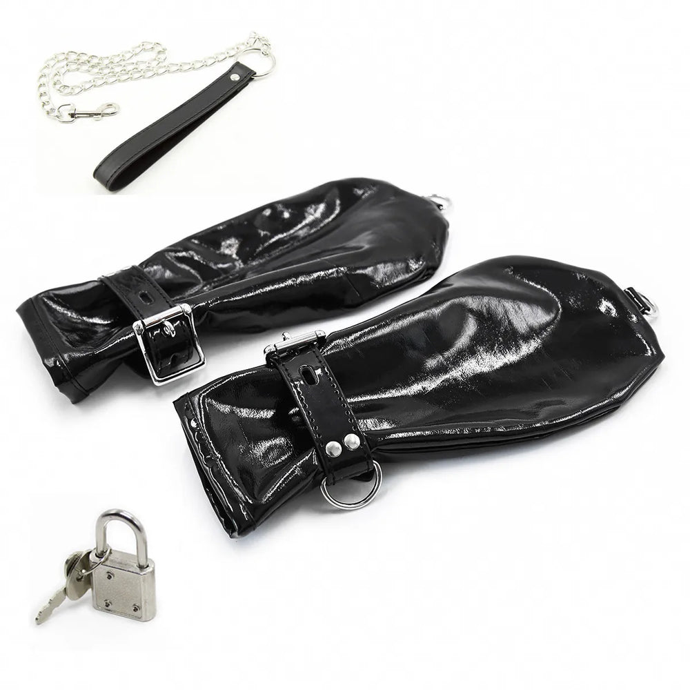 Two black glossy leatherette gauntlets with buckles, rings, chain, and padlock on white