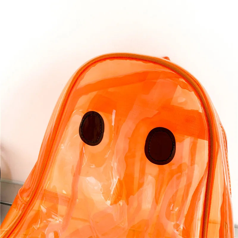 Close-up of a translucent orange ghost-shaped backpack with two black oval eyes