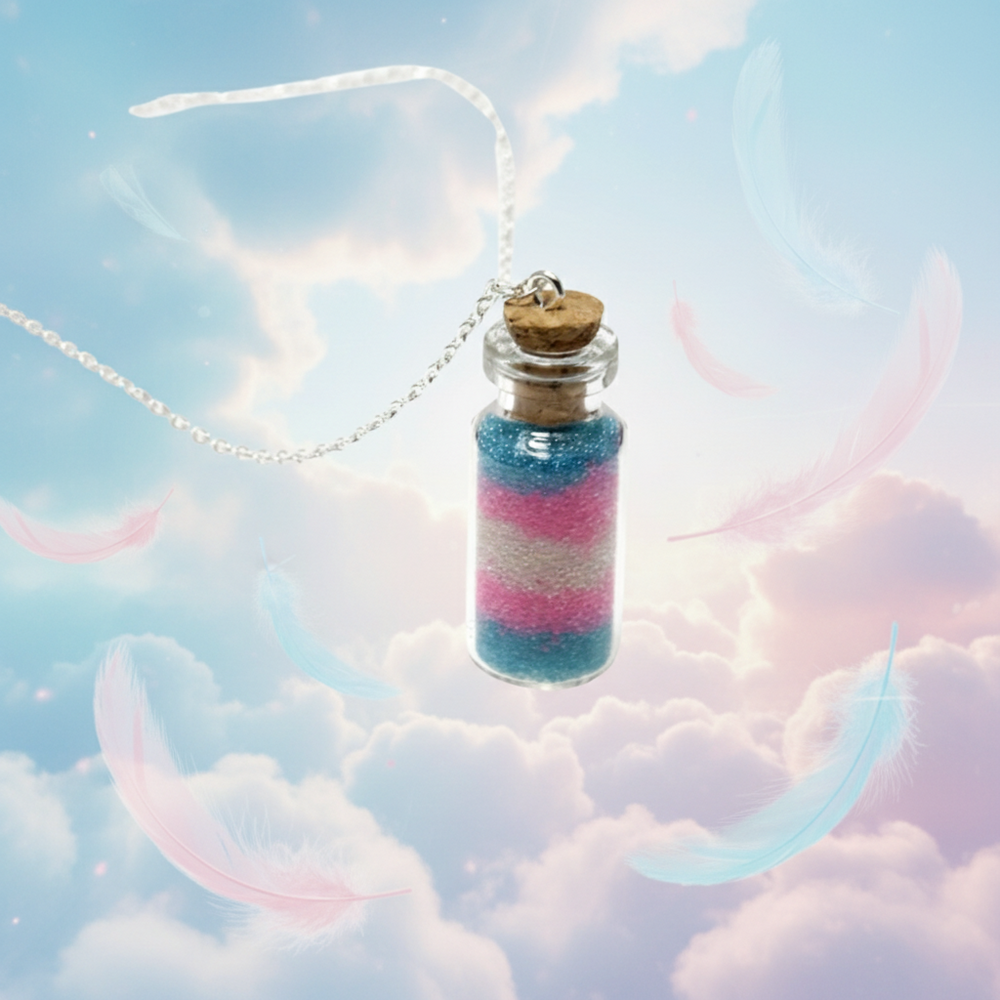 Glass vial necklace filled with blue, pink, and white layers, floating over clouds