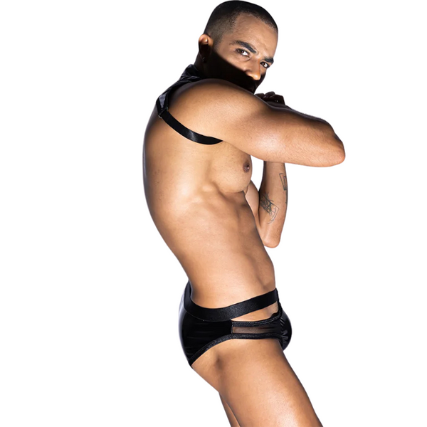 Model turned partly away, wearing black strappy briefs and a shoulder harness