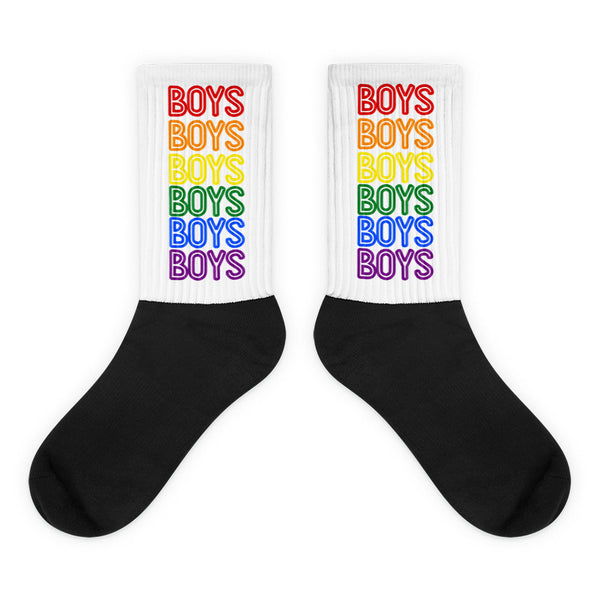 Pair of crew socks with black feet and white cuffs reading “BOYS” in rainbow colors