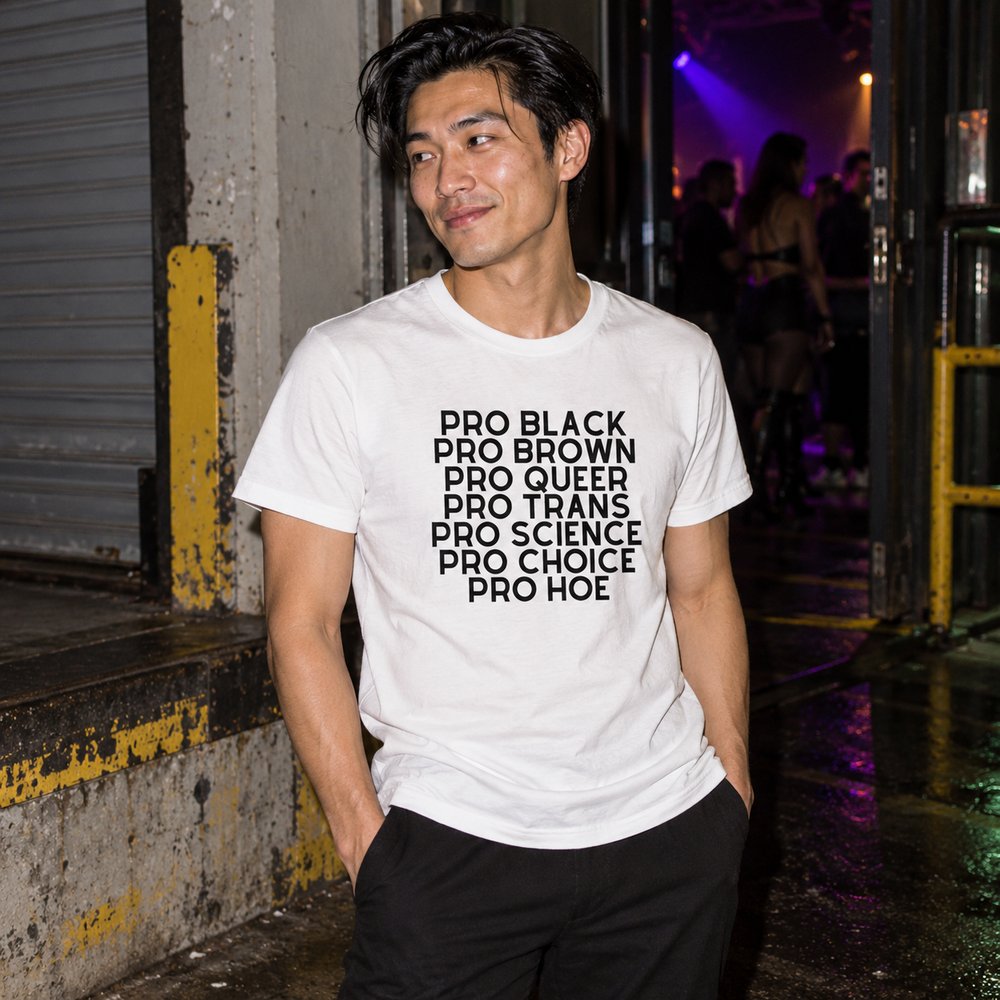 Pro Hoe (Black Text) T-Shirt in White, worn at a concrete loading-bay entrance after a queer club night.