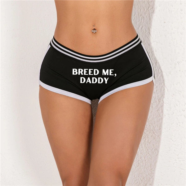 Front view of black briefs with white trim and “BREED ME, DADDY” text