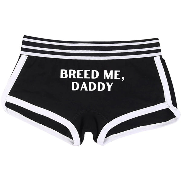 Front view of black briefs with white trim and “BREED ME, DADDY” text