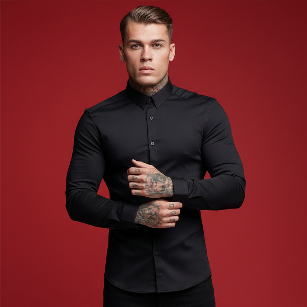 Front-facing model wearing a fitted black long-sleeve button-up shirt against a red background