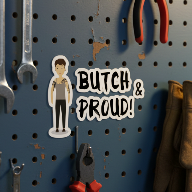 Bubble-free sticker with “BUTCH & PROUD!” in bold on a blue pegboard, cartoon butch with tattoos, tools