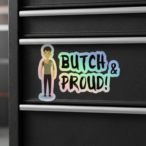 Butch & Proud holographic sticker with rainbow-outlined slogan, cartoon person