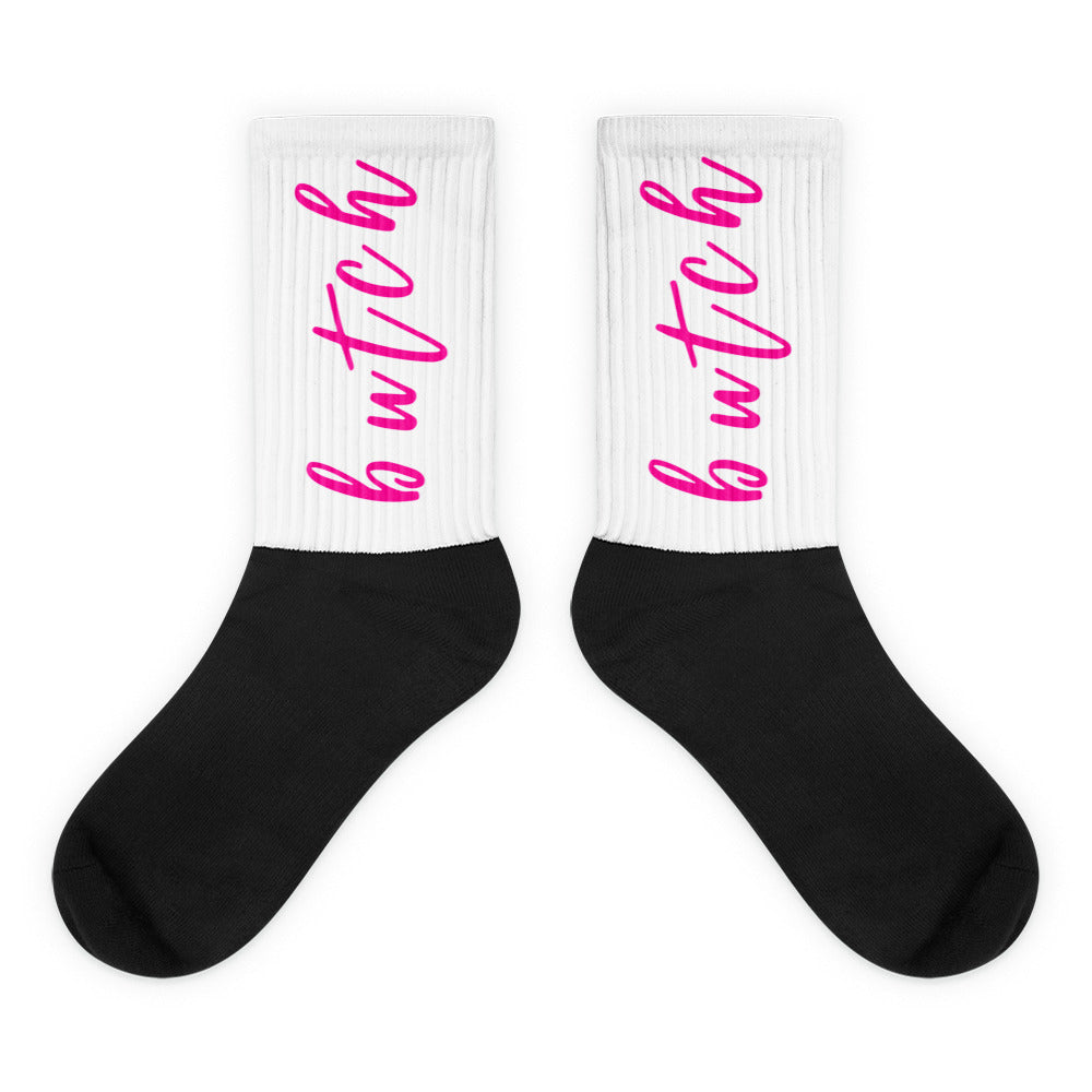 Butch Socks: Crew-length socks with black foot, white ribbed cuff, and bwtch. in bright pink cursive