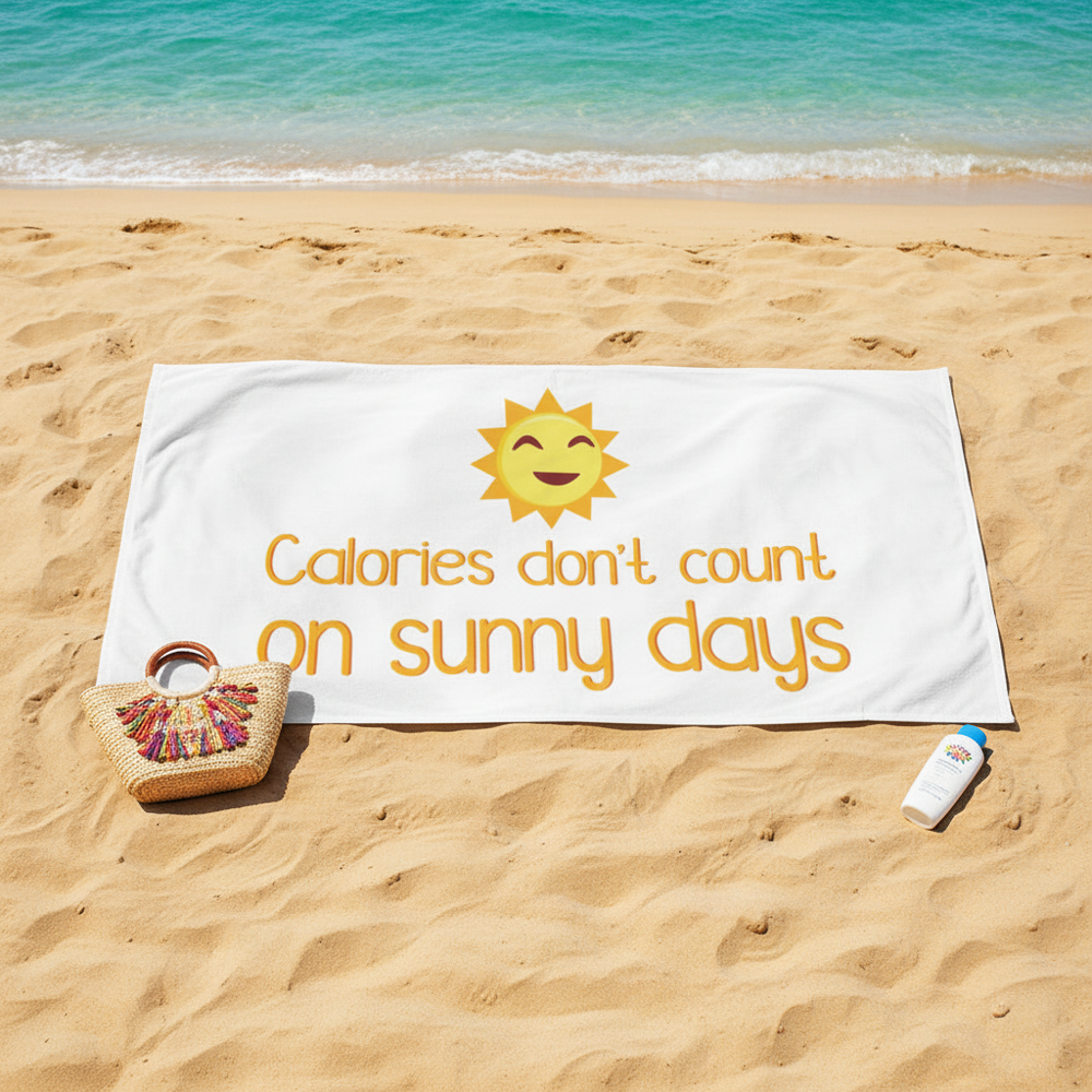 Beach towel with “The Calories Don't Count On Sunny Days” slogan, smiling sun, pink bag, shades