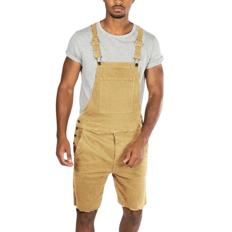 Front view of a person wearing tan bib overalls with shorts over a gray T-shirt
