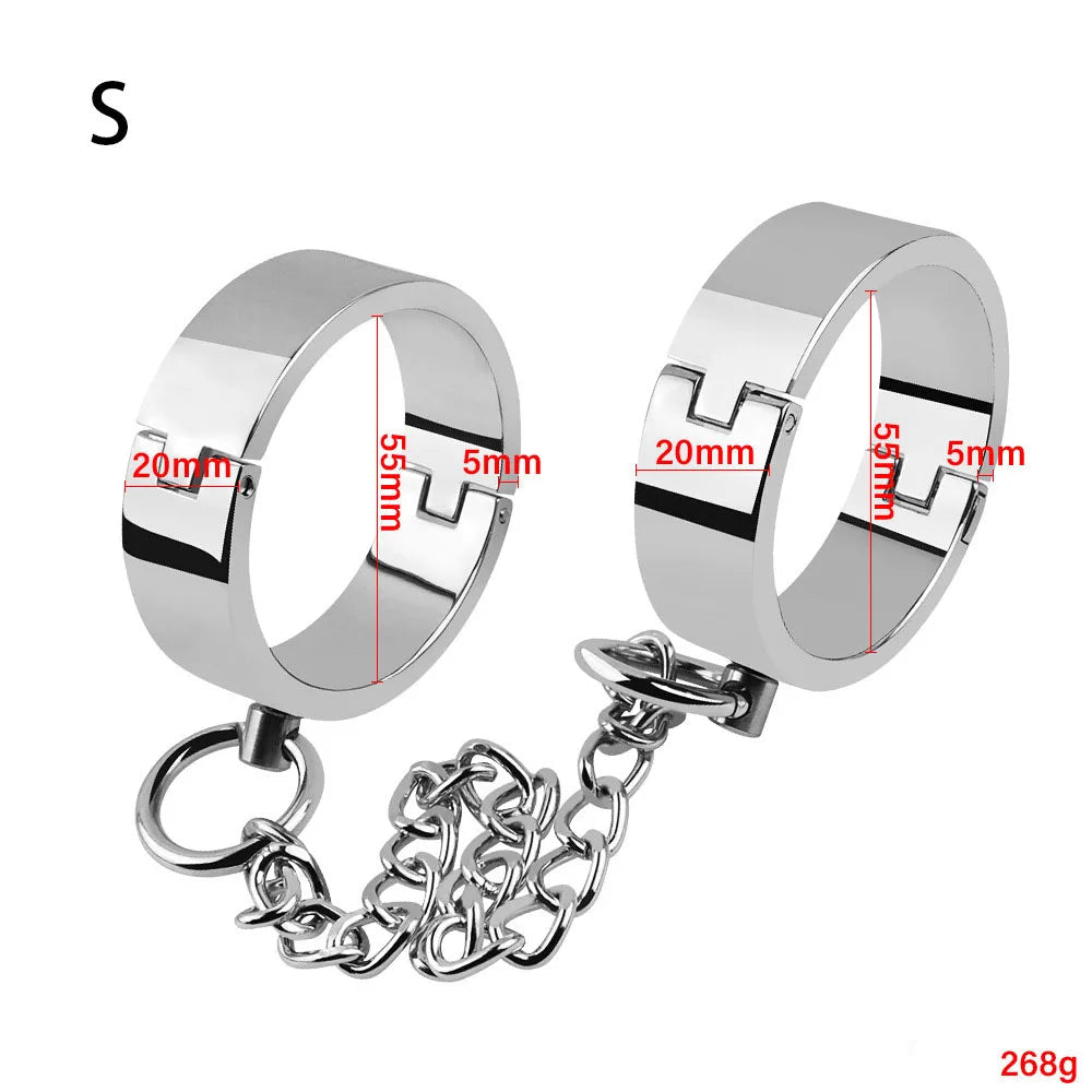 Pair of silver metallic bondage cuffs linked by a chain, shown with size markings