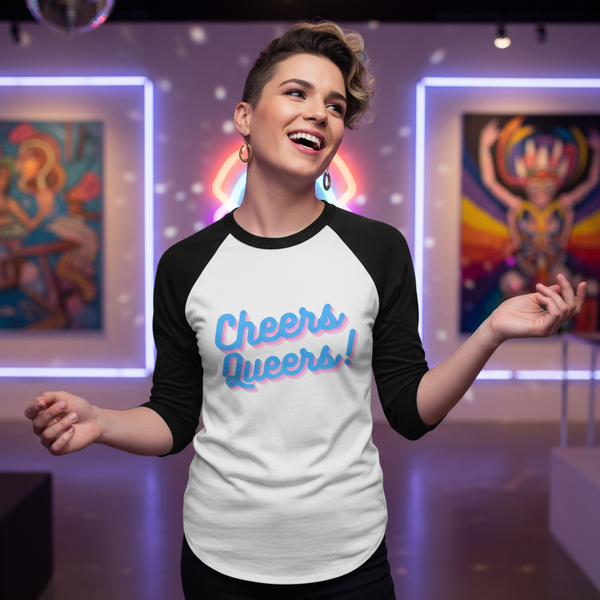 Cheers Queers! 3/4 sleeve raglan tee on a smiling person, hoop earrings, in a bold gallery of vibrant queer art and lights