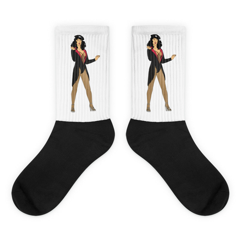 Pair of black-and-white socks with matching burlesque performer illustrations on the calves