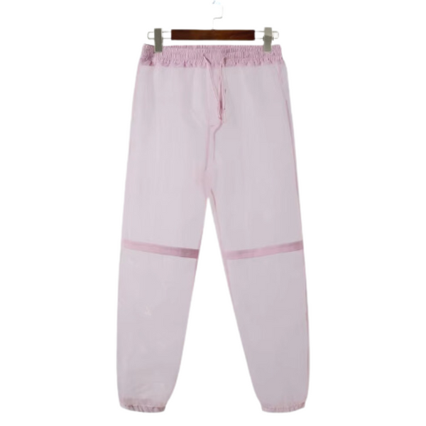 Light pink transparent runway pants with darker pink stripe bands, front view on a hanger