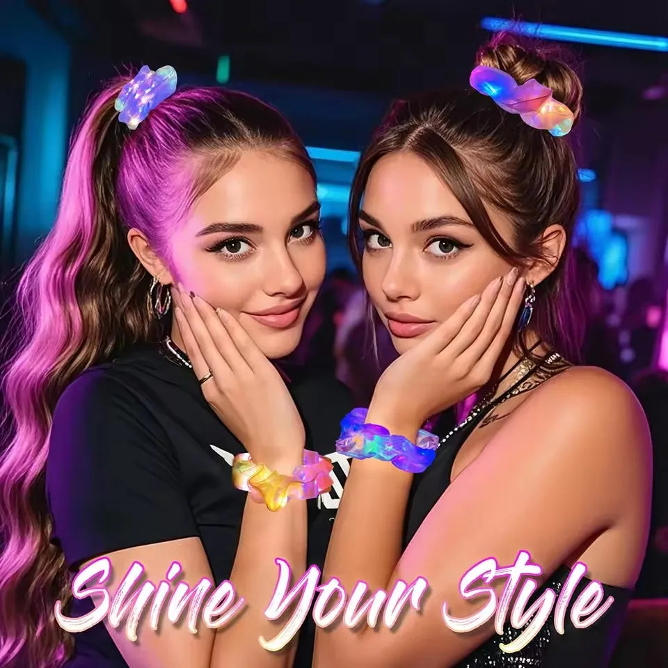 Two people wearing glowing multicolor LED scrunchies in their hair and on their wrists