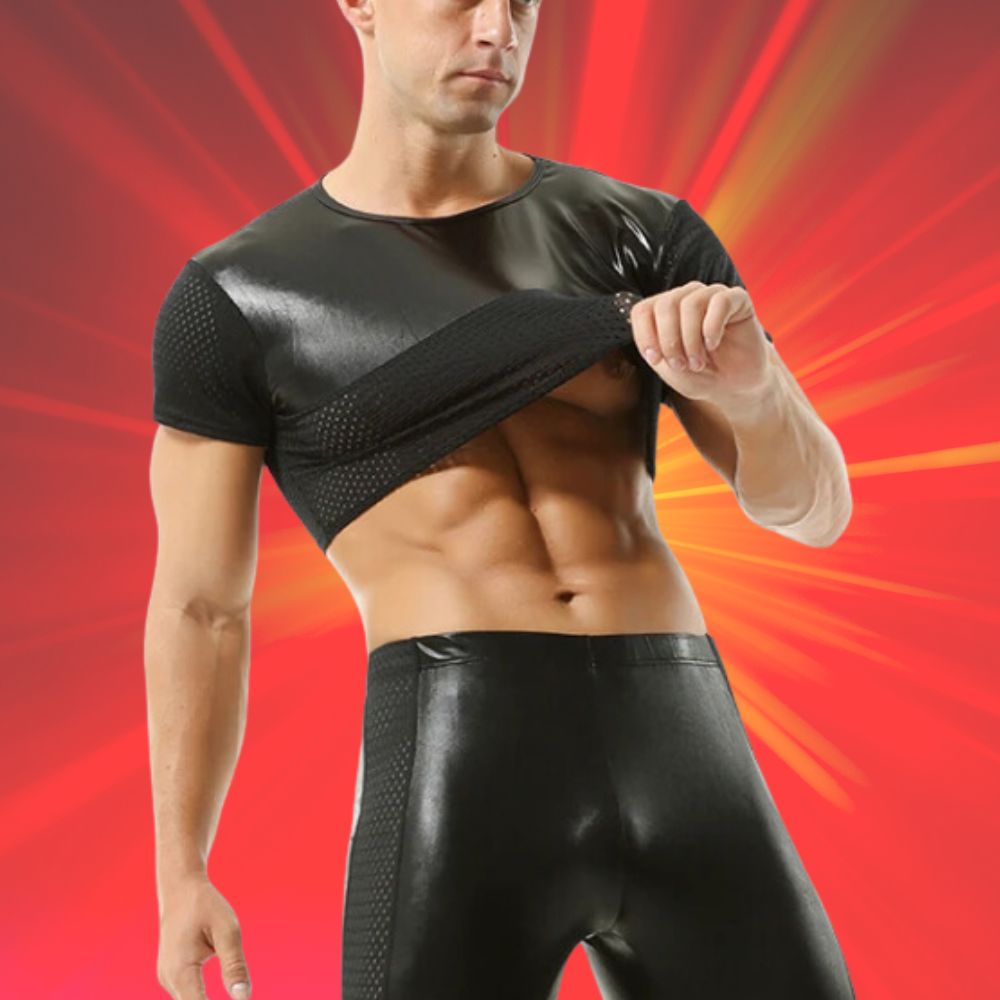 Front view of a person lifting a black short-sleeve crop top to reveal their torso