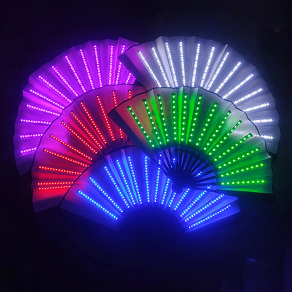 Five partially opened LED folding fans glow purple, white, red, green, and blue in a dark setting
