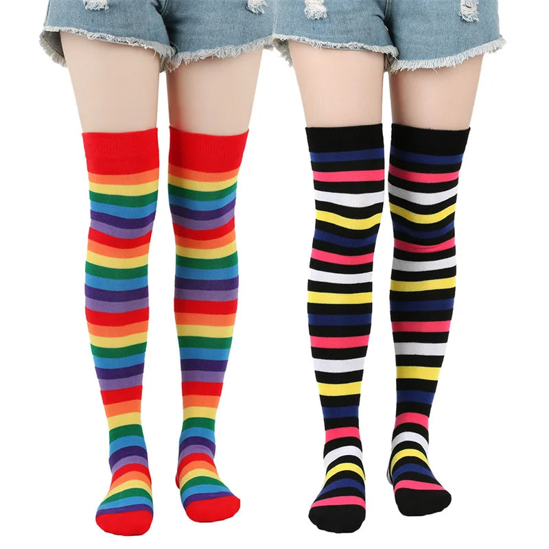 Two pairs of thigh-high striped socks shown on mannequin legs: rainbow and black multicolor