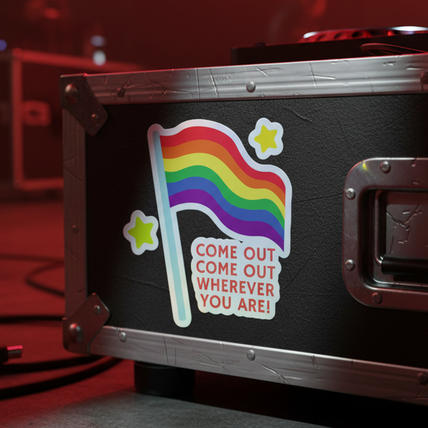 Holographic rainbow flag sticker reading “COME OUT COME OUT WHEREVER YOU ARE!” on a black road case