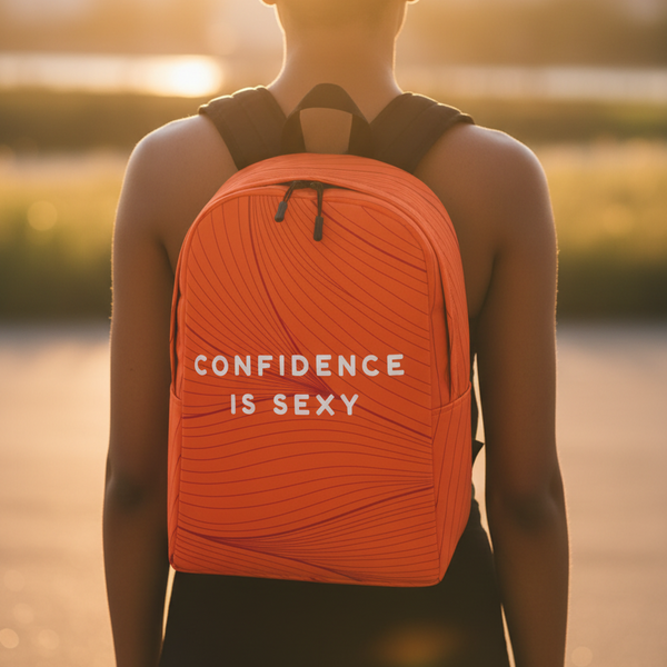 Confidence Is Sexy Minimalist Backpack in bold orange with crisp white 