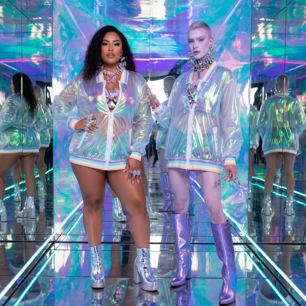 Two models wearing iridescent zip-front jackets in a mirrored, colorful room