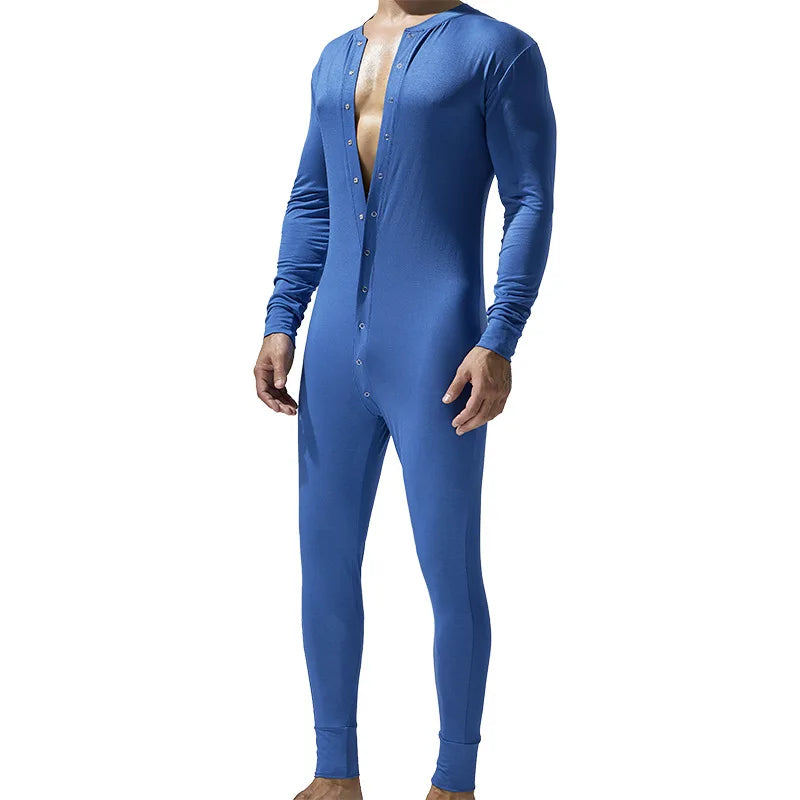 Front view of a person wearing a fitted blue long-sleeve pajama romper with buttons