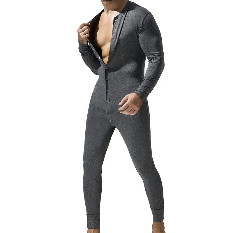 Front-view model in a fitted charcoal-gray long-sleeve pajama romper, partly unbuttoned