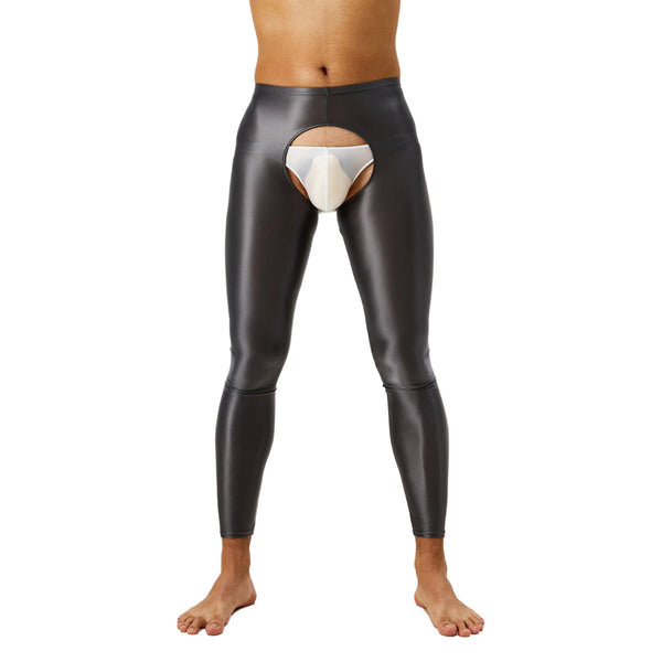 Front view of a model wearing glossy black crotchless leggings with a large oval opening