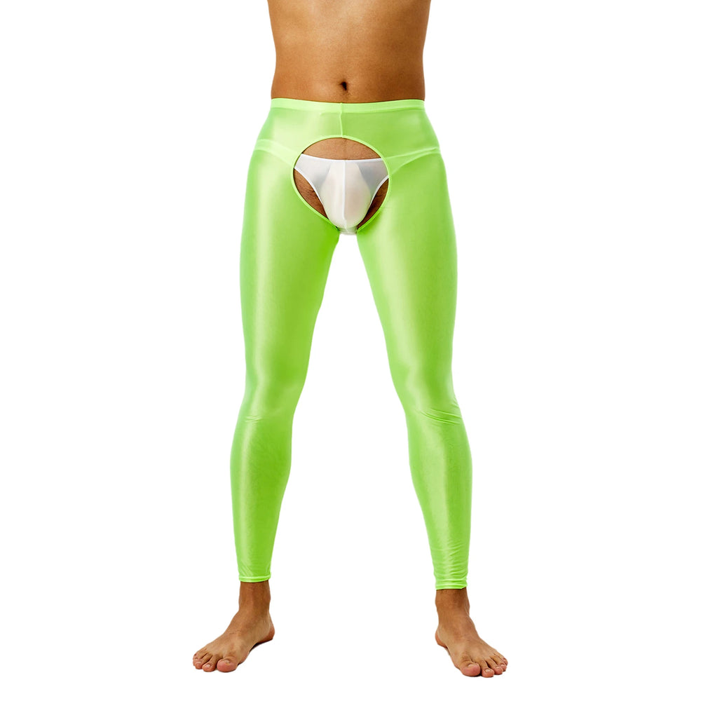 Front view of a model wearing neon-green shiny crotchless leggings over a white pouch brief