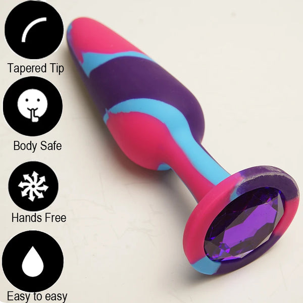 Colorful tapered butt plug with a large faceted purple jewel base