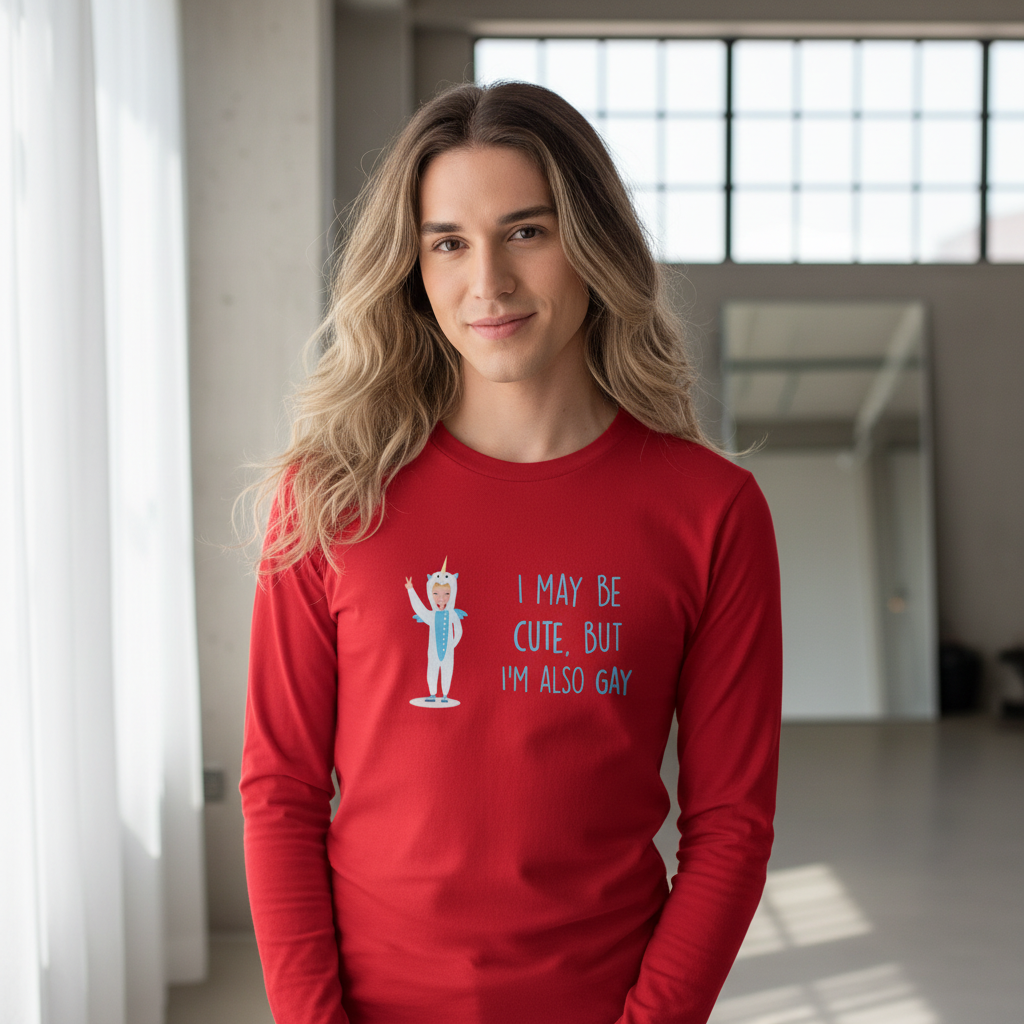 Unisex long sleeve tee reads “I may be cute, but Im also gay” with cartoon art; worn by person with wavy blond hair