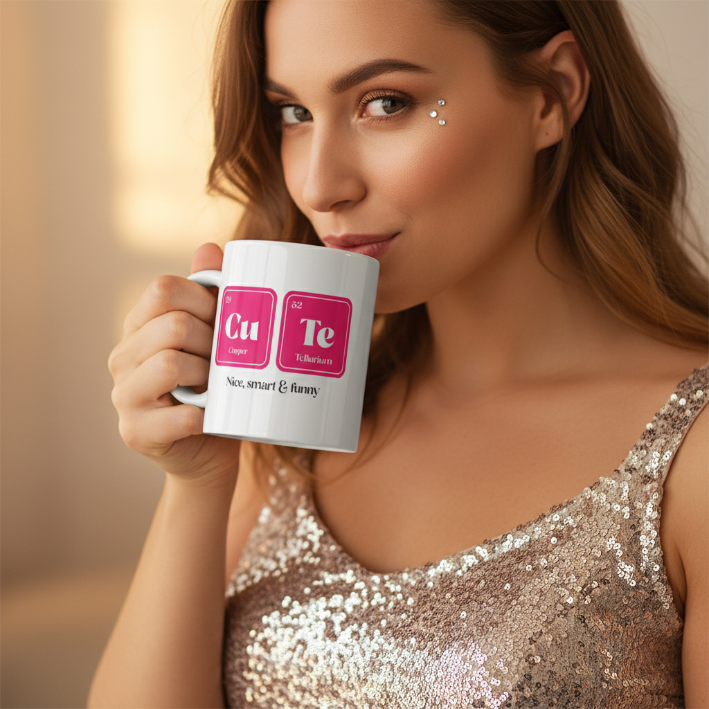 Person in a sequined top sipping from a white “Cu Te” periodic-table mug