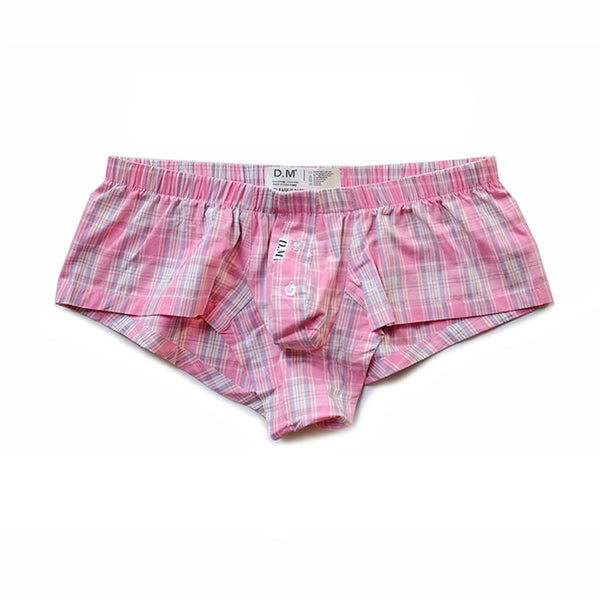 Front view of pink plaid boxer shorts laid flat, with a button fly and D.M. waistband label