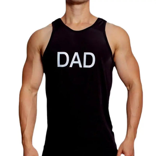Front view of a muscular model wearing a black sleeveless tank top marked “DAD” in white
