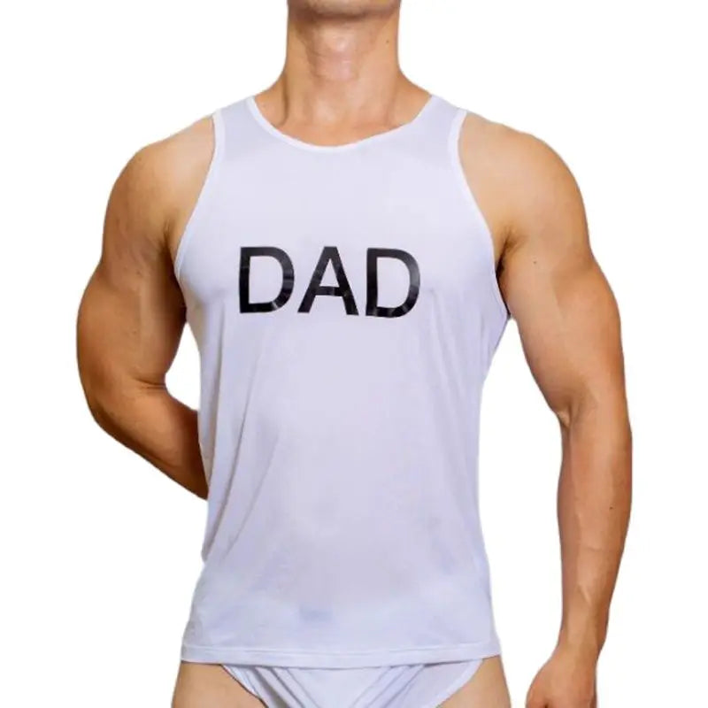 Front view of a muscular model wearing a light lavender tank top reading “DAD”