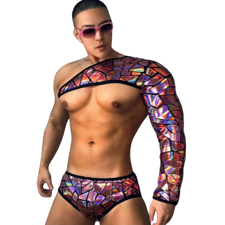 Shirtless model wearing an asymmetrical iridescent mosaic crop top and matching brief