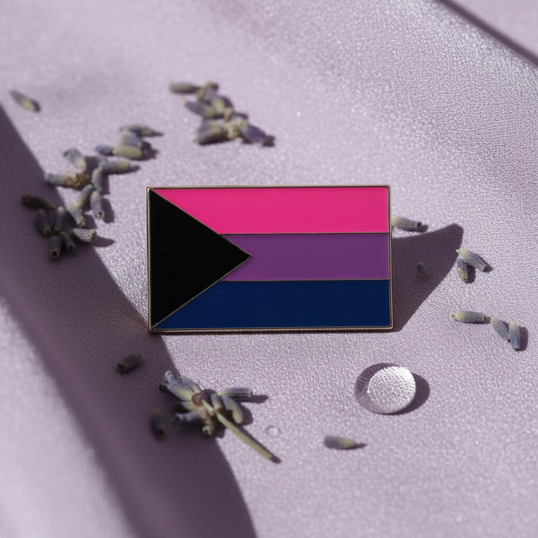Rectangular pink, purple, and blue pride flag pin with a black triangle on lavender fabric