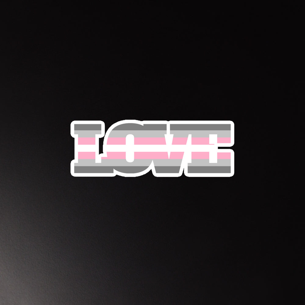 LOVE magnet with pink, gray, and white horizontal stripes on a black background