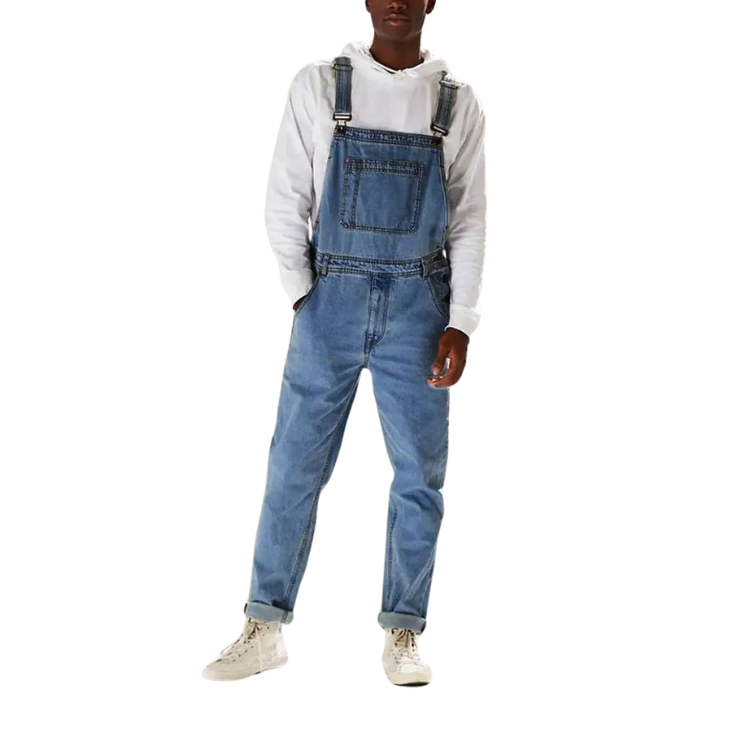 Front-view model wearing blue denim overalls over a white hooded sweatshirt