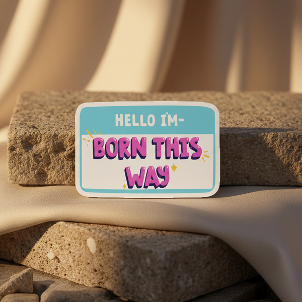 Rectangular magnet reading “HELLO I’M—BORN THIS WAY” on stacked stones