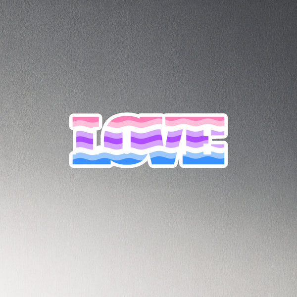 Flat-lay magnet reading “ICME” in pink, purple, and blue wavy stripes