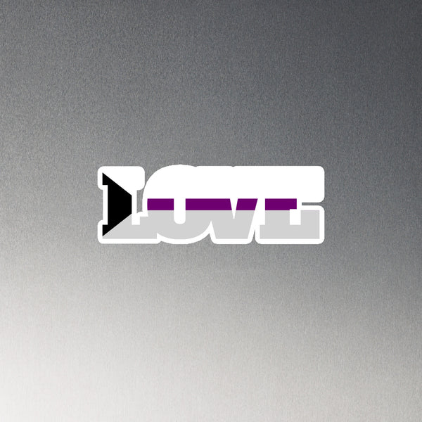 Demisexual Love Magnet features bold LOVE in white, with a purple stripe, gray fill, and black triangle, embodying asexual-pride colors. Crafted from flexible vinyl, it's a queer expression of style.