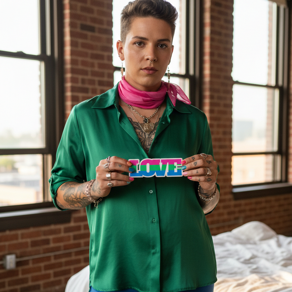 Person proudly holding LOVE sign with Polysexual Love Magnet, showcasing bold queer style. Celebrates LGBTQIA+ pride with vibrant flair, embodying self-expression and empowerment in a chic studio setting.