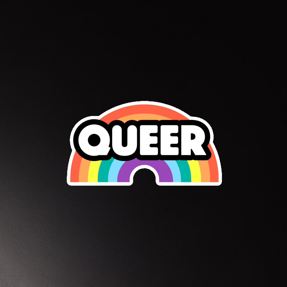 Front-facing rainbow magnet with bold white “QUEER” lettering on a black outline