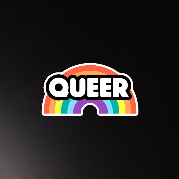 Front-facing rainbow magnet with bold white “QUEER” lettering on a black outline