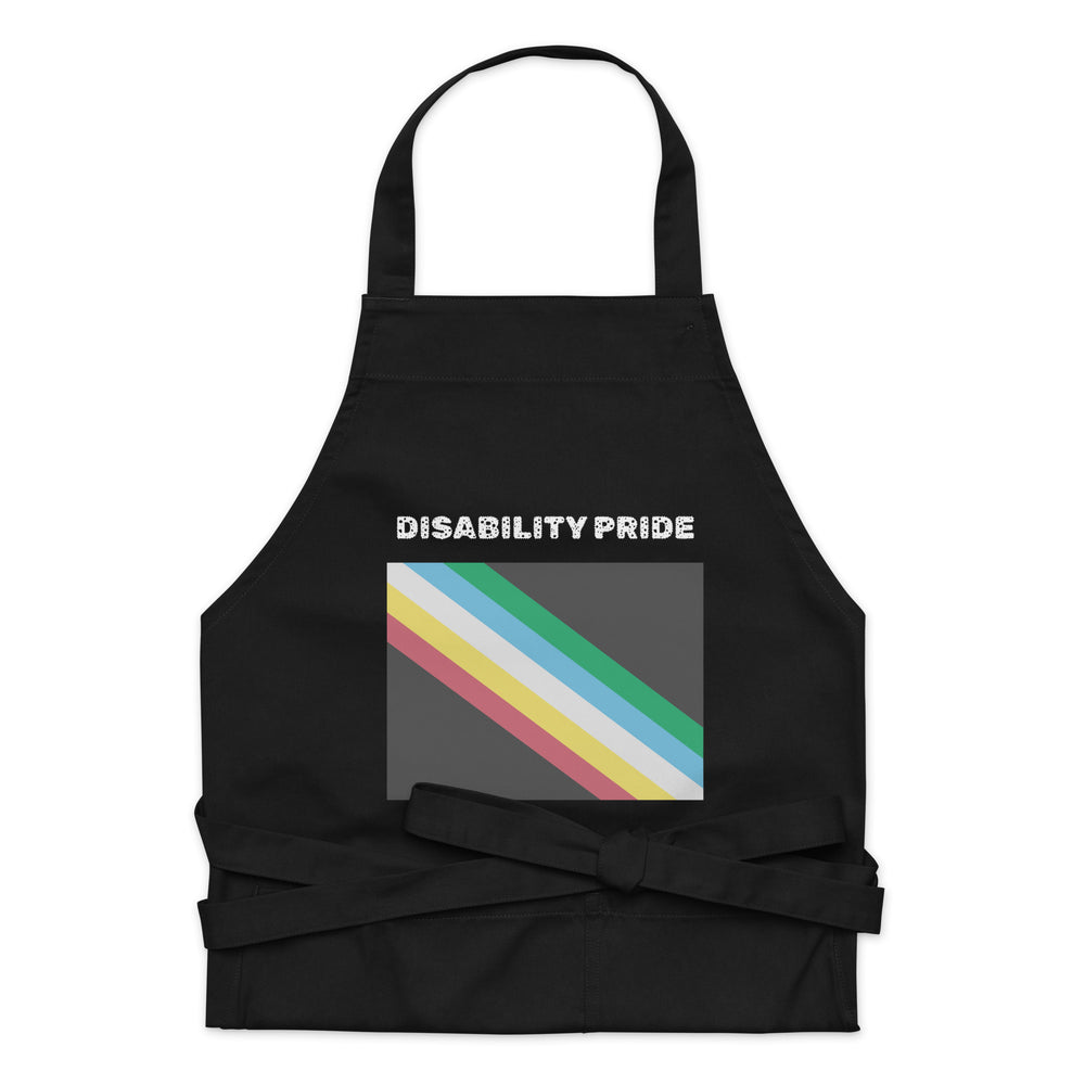 Front view of a black apron reading “DISABILITY PRIDE” above diagonal rainbow stripes.