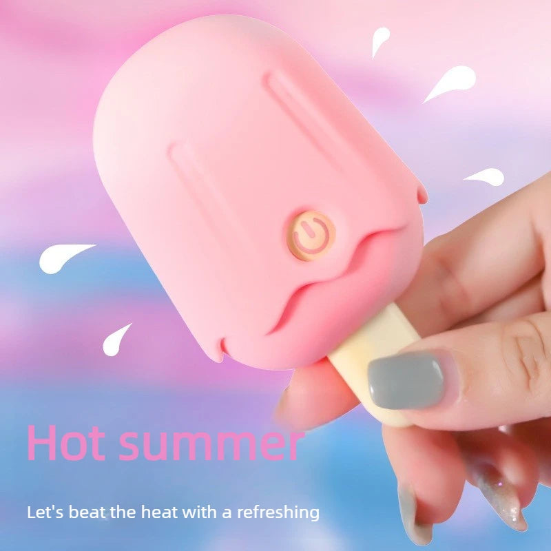 Discreet Bedside Ice Cream Clitoris Vibrator: hand holding the pink ice-cream-shaped device to show its size.