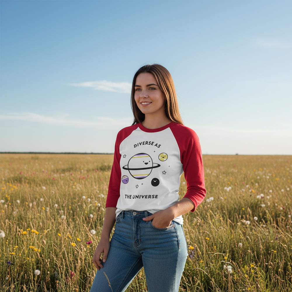3/4 sleeve raglan shirt reads “Diverse As The Universe” with colorful planets, stars; model in wildflower field, blue sky